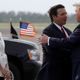 President Donald Trump shakes hands with Florida Gov. Ron DeSantis as he arrives at Tyndall Air Force Base to view damage from Hurricane Michael, and attend a political rally, Wednesday, May 8, 2019.
